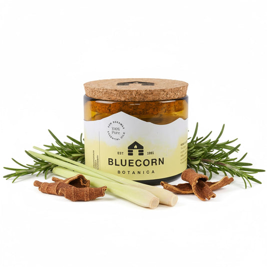 Bluecorn Beeswax large 3-wick candle in amber glass front view adds warm dining ambiance