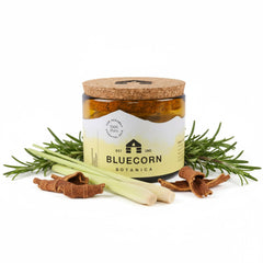 Bluecorn Beeswax large 3-wick candle in amber glass front view adds warm dining ambiance