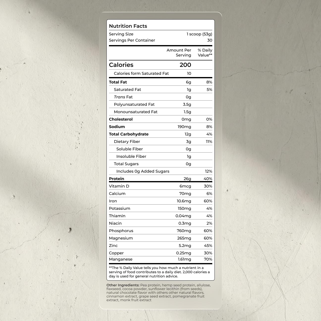 Blueprint Bryan Johnson protein powder scoop shows 26g protein per serving for plant-based nutrition.