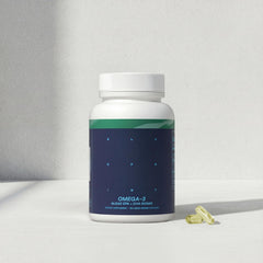 Blueprint Bryan Johnson Omega-3 bottle on desk ready for daily routine.