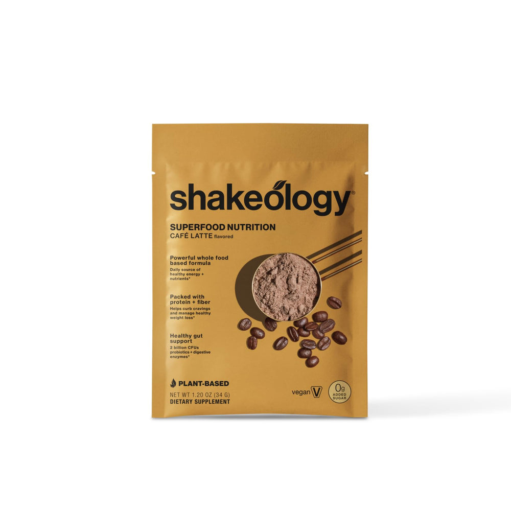 Creamy BODi Shakeology Cafe Latte shake poured into a glass.