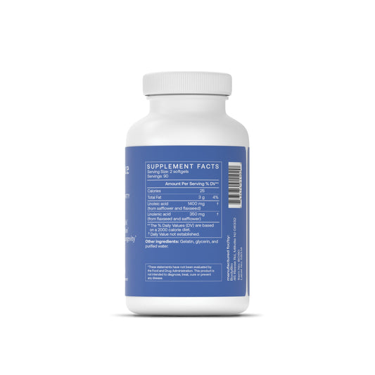 BodyBio Balance Oil being poured into a spoon for easy daily use