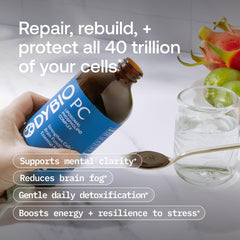 Pouring BodyBio PC bottle highlights easy dosing for daily use.