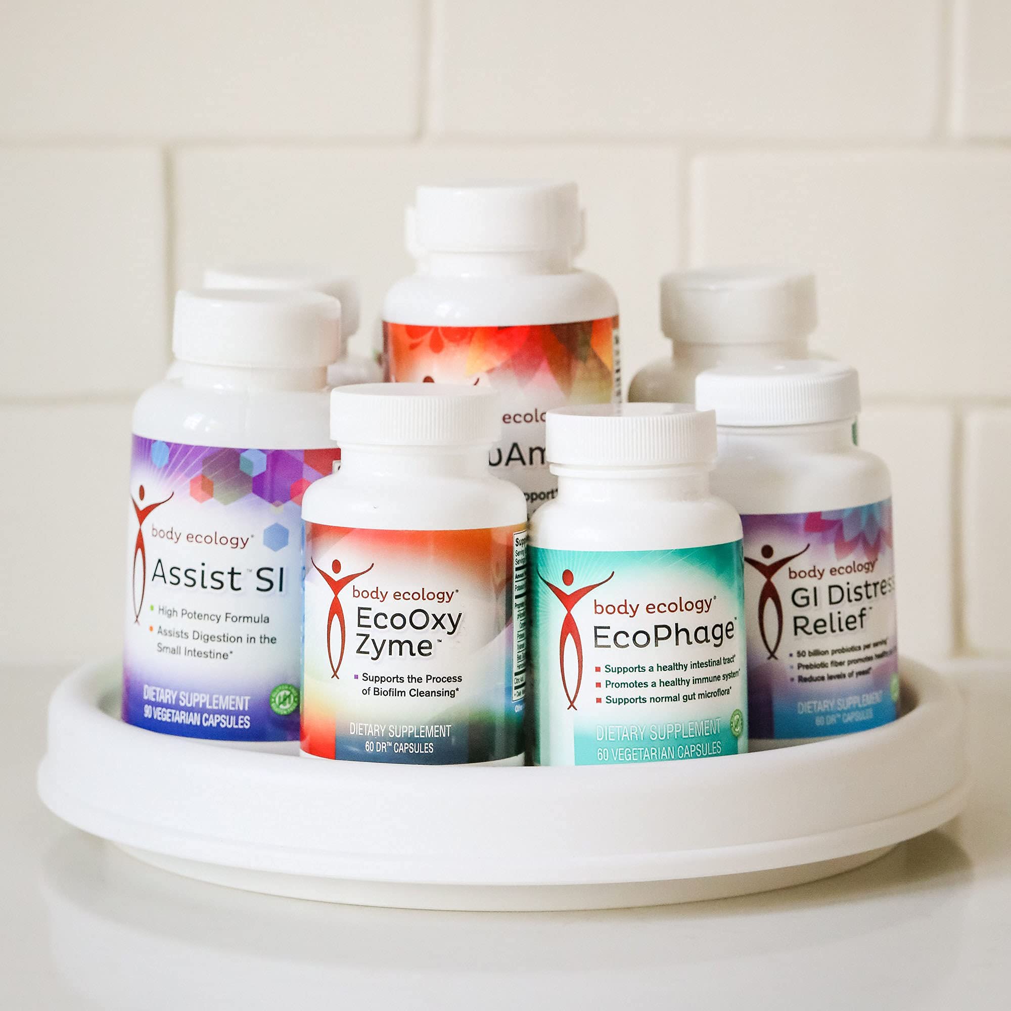 Body Ecology EcoOxyZyme kitchen glass with bottle inspires easy daily intake.