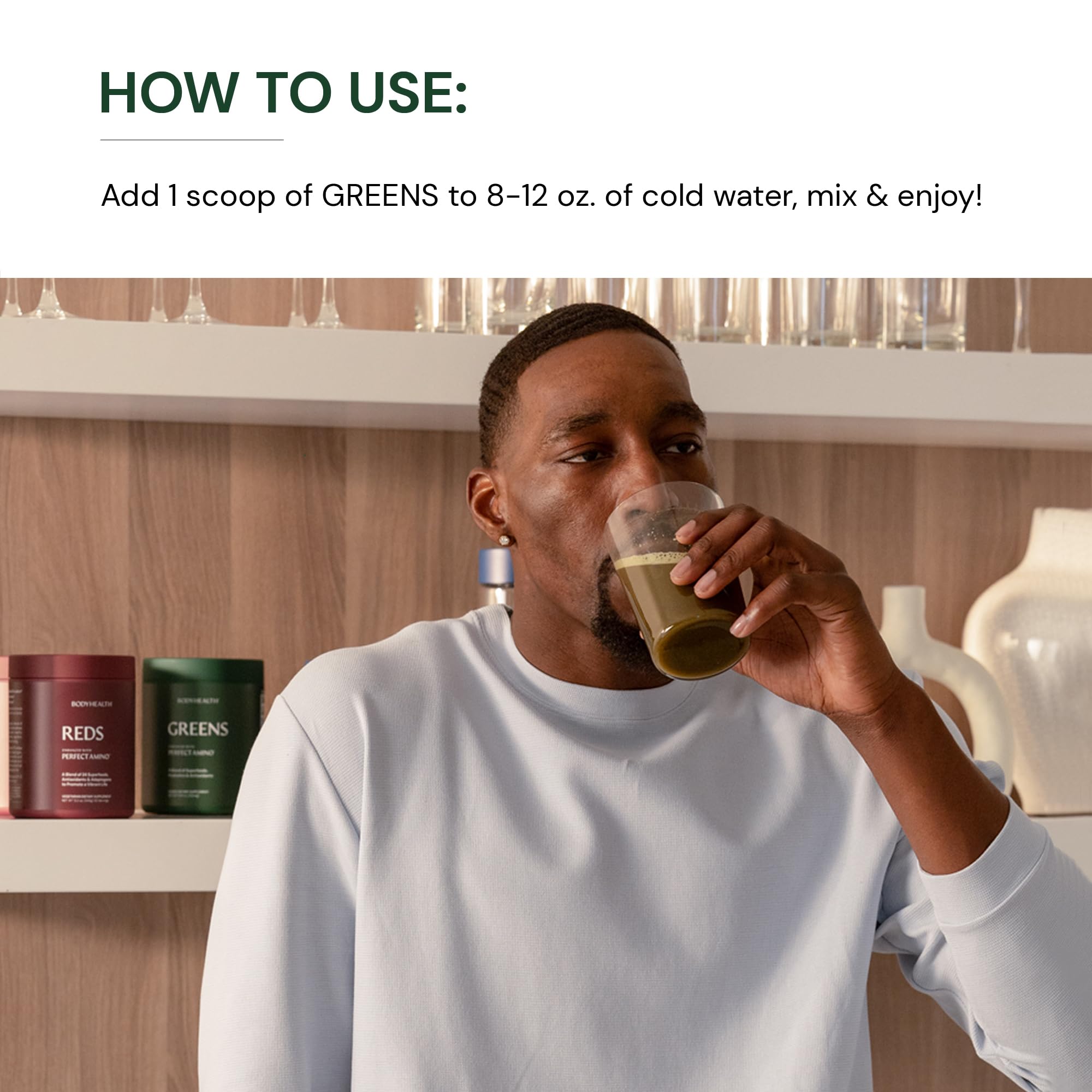 BodyHealth Greens smoothie in glass highlighting green apple flavor.