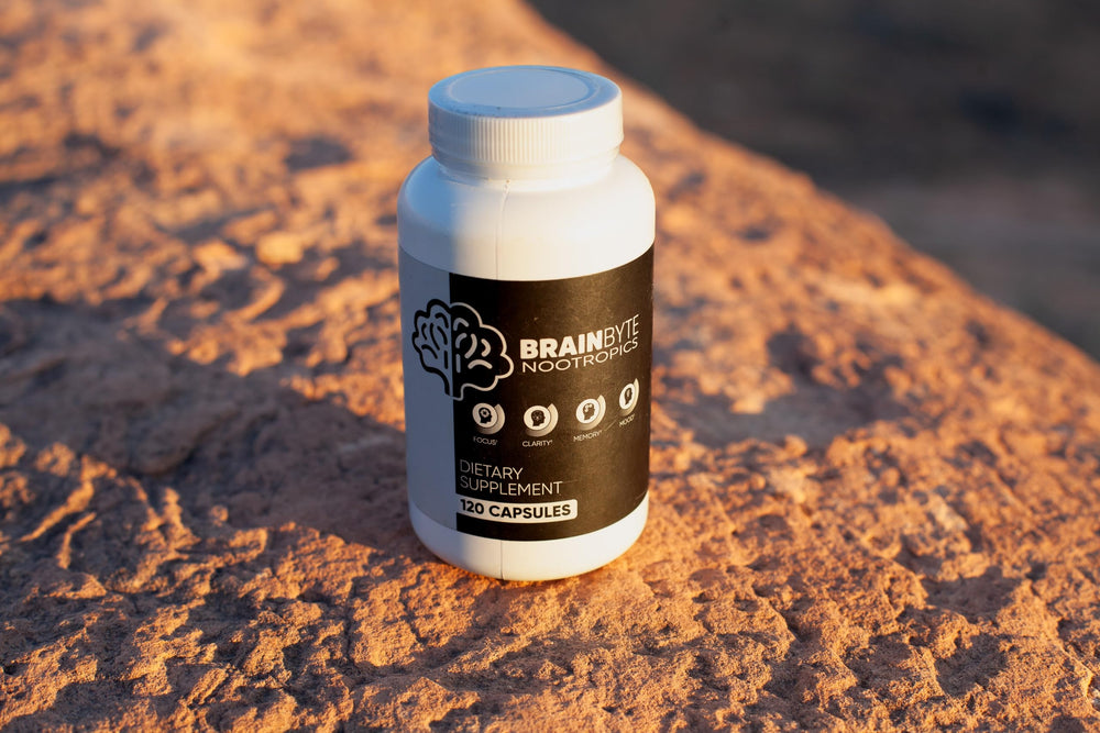 BrainByte All-in-One spoon beside jar for convenient serving.