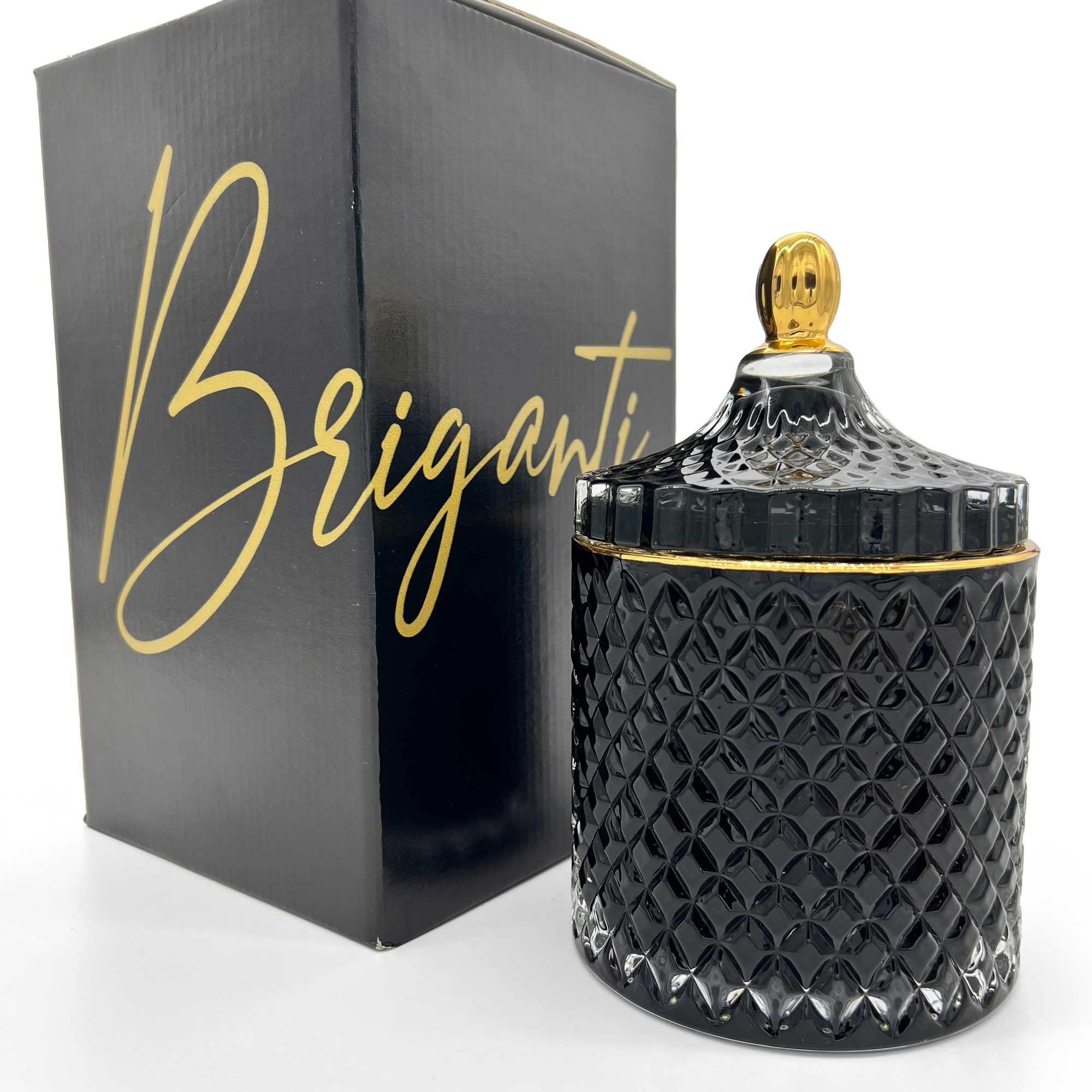 BRIGANTI Pomegranate Bliss soy candle in a black glass jar with a gold rim for elegant décor.