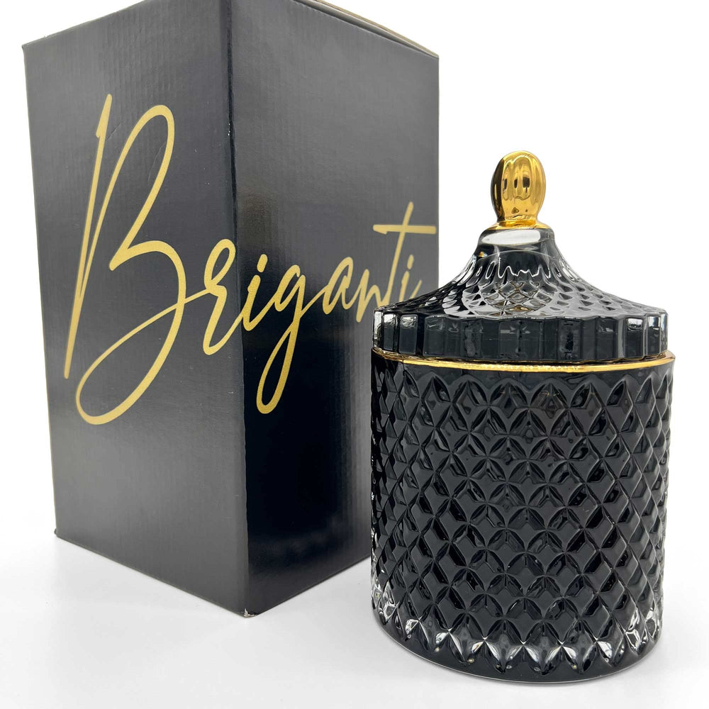 BRIGANTI Pomegranate Bliss soy candle in a black glass jar with a gold rim for elegant décor.