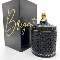 BRIGANTI Pomegranate Bliss soy candle in a black glass jar with a gold rim for elegant décor.