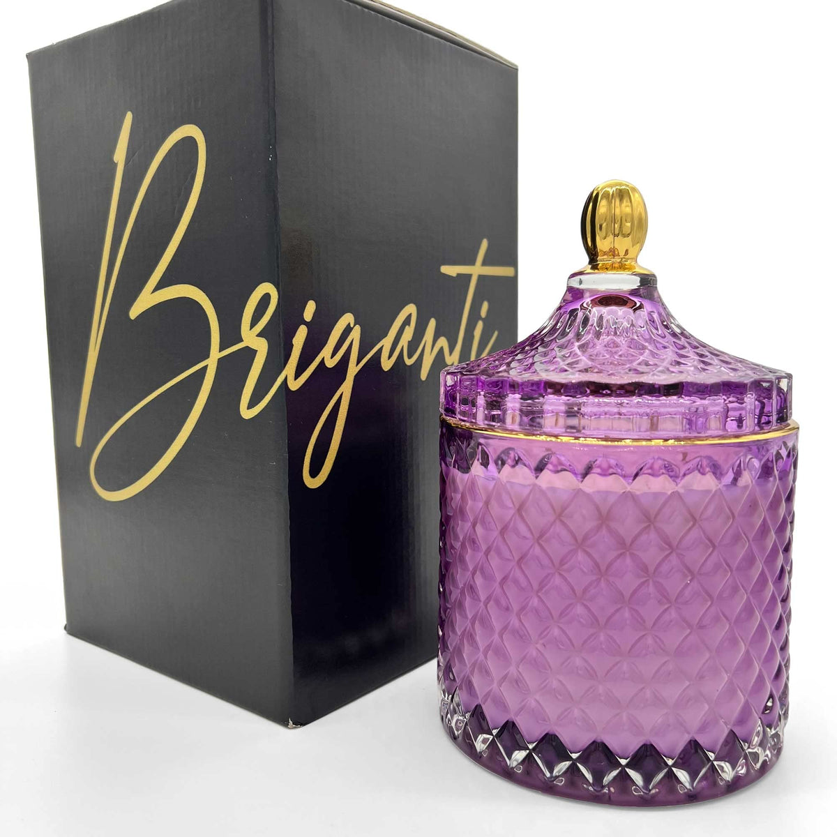 BRIGANTI large violet glass jar candle with gold rim, creating elegant ambiance and inviting fragrance.