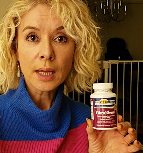 Bright Nutrition FibroBlend capsules being poured for easy daily use