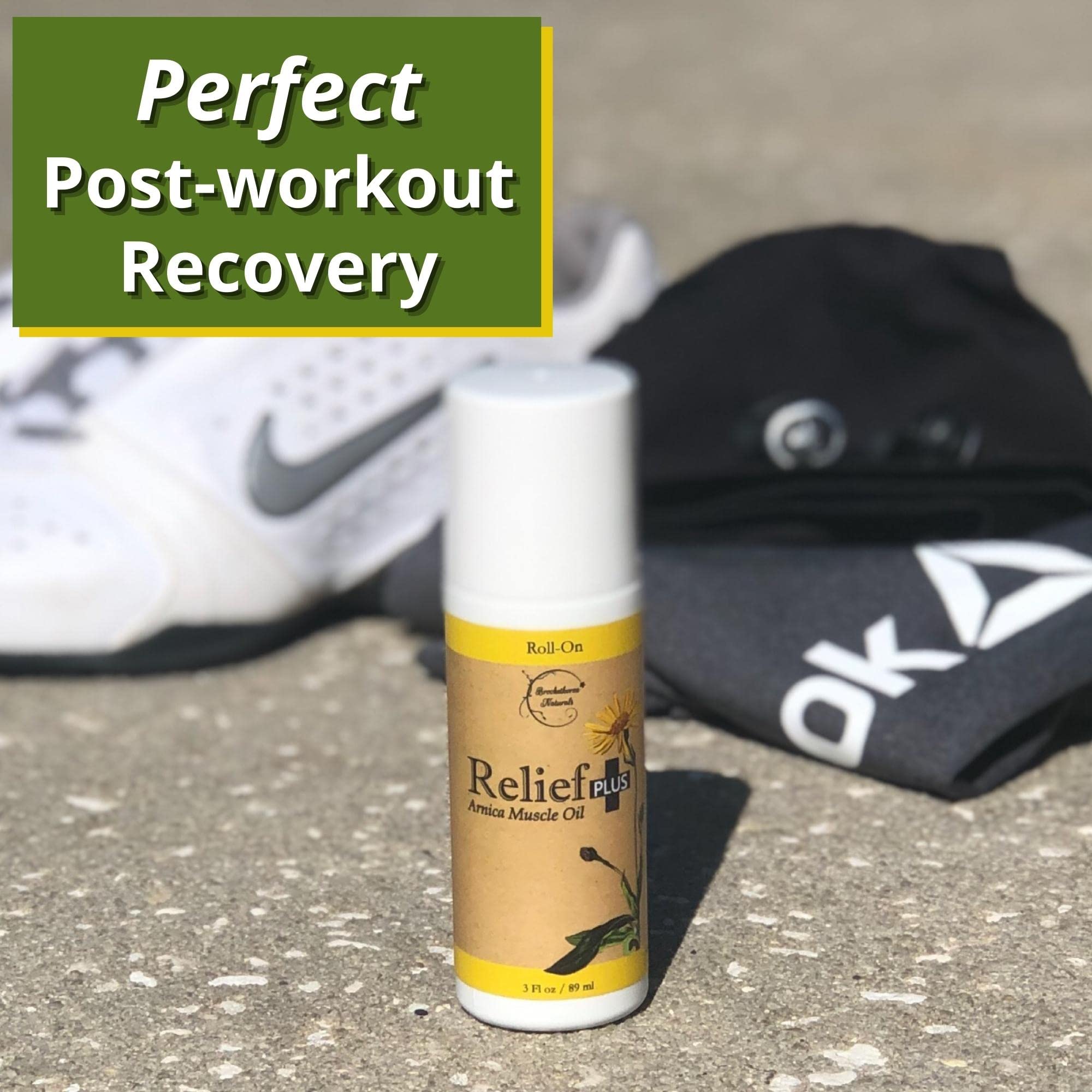 Brookethorne Naturals Relief Plus Arnica Muscle Oil beside gym towel