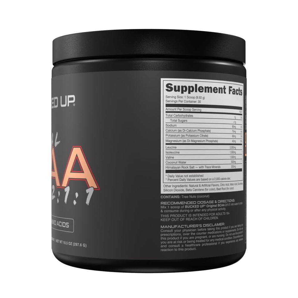 Peach Ring Bucked Up BCAA scoop dissolving in water for workouts.