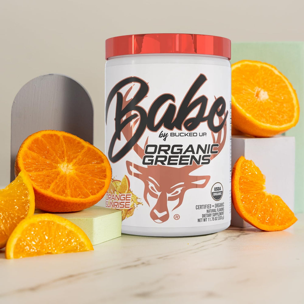 Close-up of Bucked Up Greens Orange Sunrise powder mixing smoothly into a protein shake.