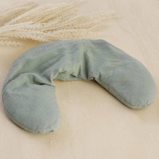 Bucky linen neck pillow sage side view illustrating ergonomic, comfortable shape.