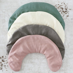 Bucky neck pillow draped over shoulders demonstrating mobility-friendly design.