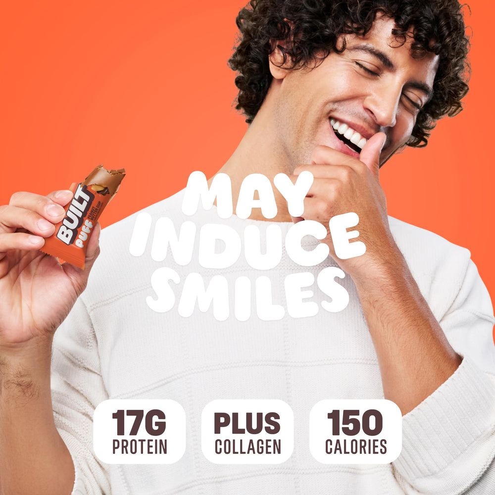 BUILT Bar Puff Peanut Butter Cup bite into creamy chocolate-covered marshmallow goodness