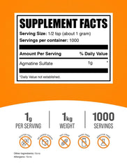 BulkSupplements Agmatine Sulfate powder scoop with glass of water for easy dosing.