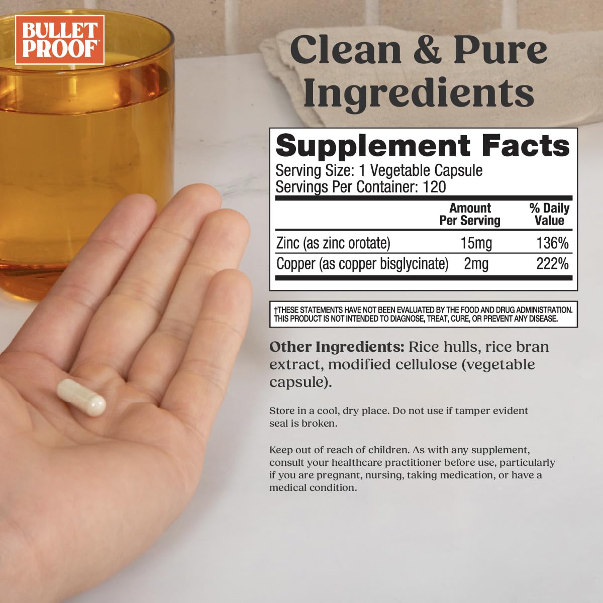 Bulletproof Zinc with Copper capsules in hand for everyday wellness