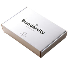 Bundariety chocolate-vanilla high protein shake served in a glass highlights quick protein boost.