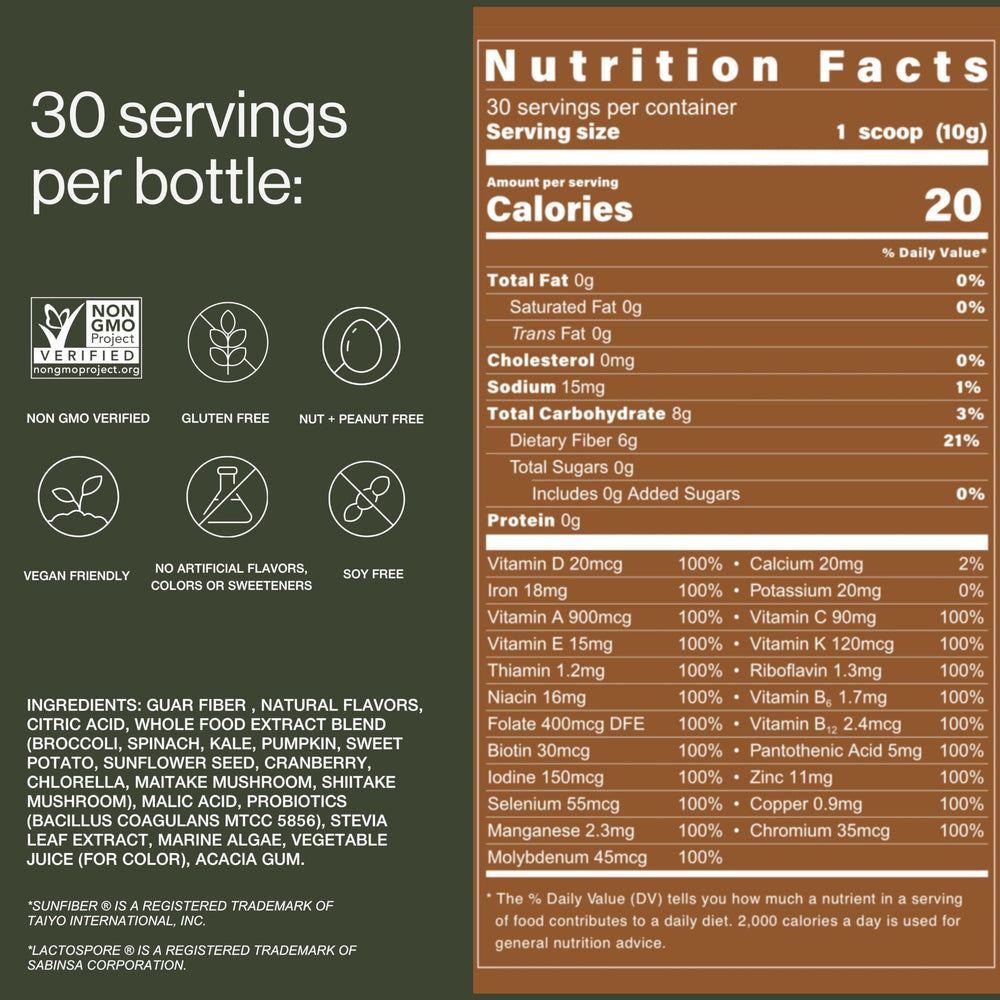 B.WILD bottle on table beside greens signaling natural ingredients for daily nourishment