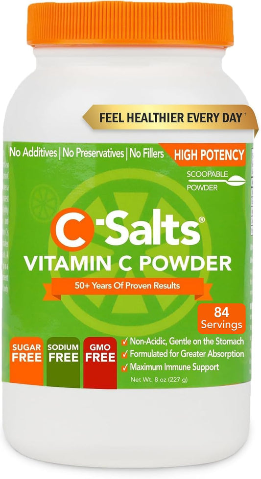 C-Salts Vitamin C powder with scoop beside water for easy daily use.