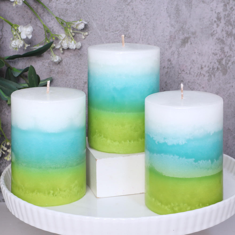 Cafemoon mint pillar candle in green, blue, and white enhances meditation space with refreshing scent.