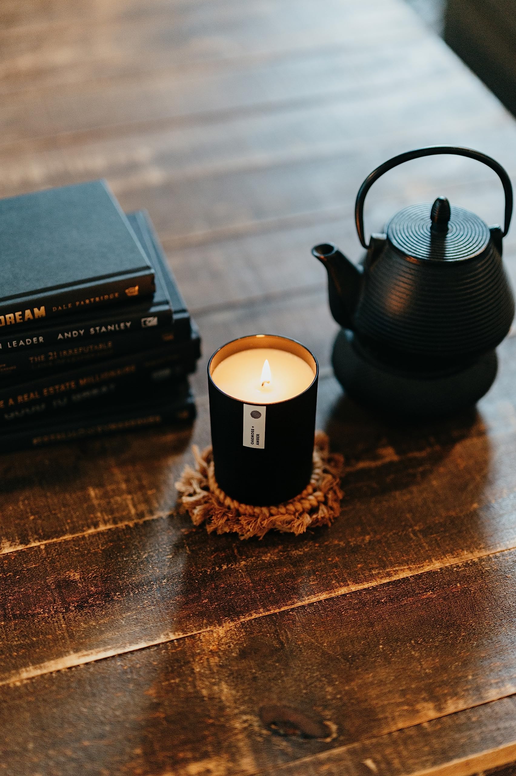 Calyan Oakmoss Amber candle in a living room adds cozy warmth