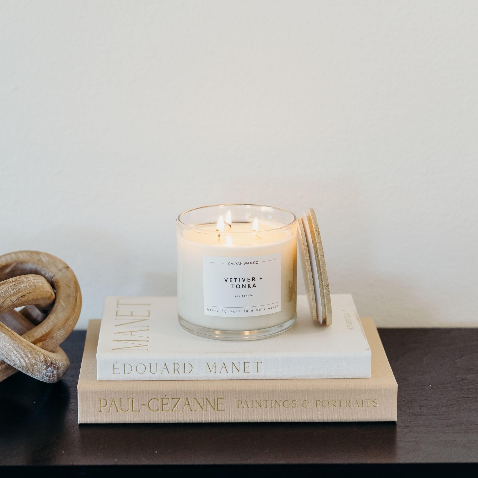 Jar glow from three wicks enhances cozy evenings.