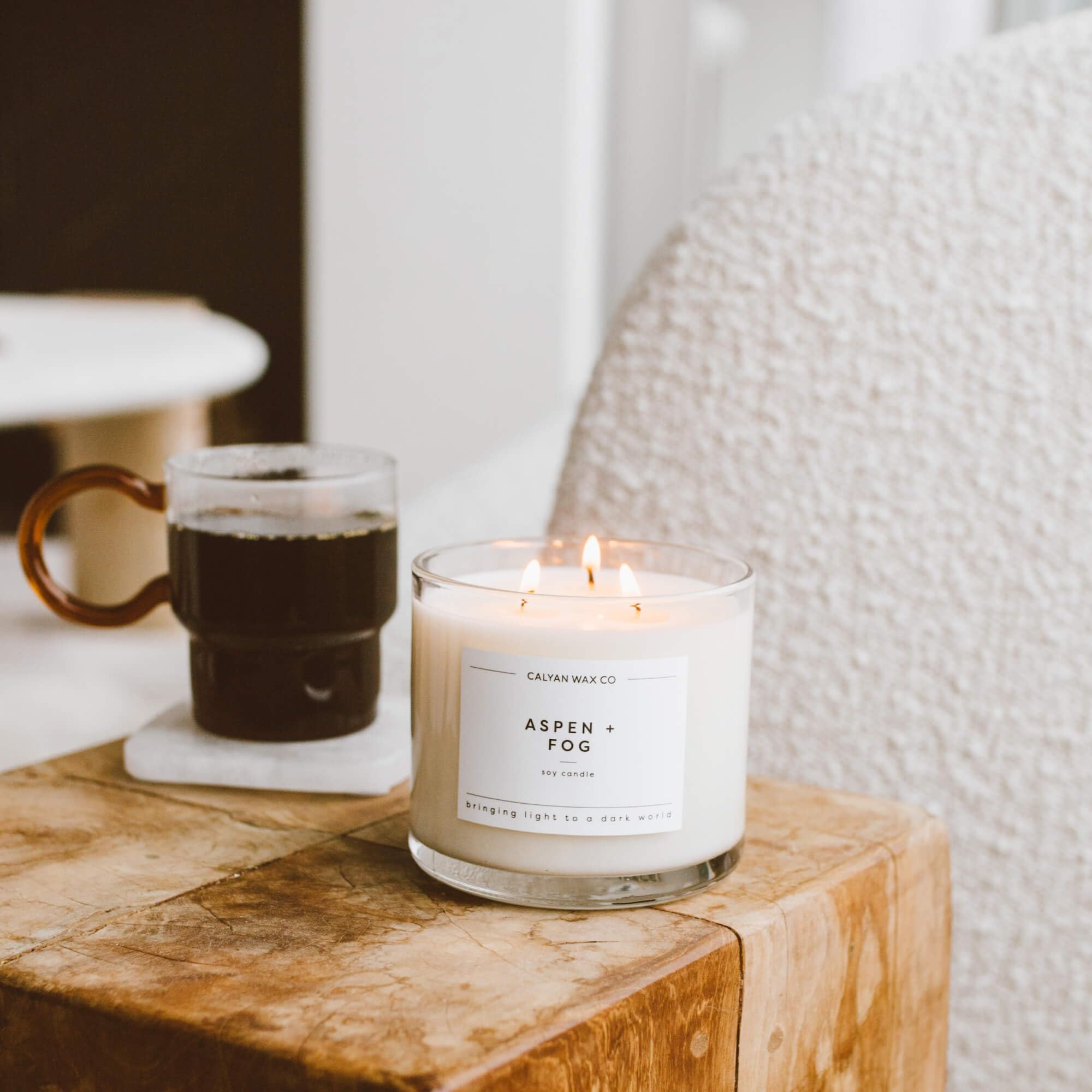 Living room scene with Aspen & Fog candle enhancing mood.