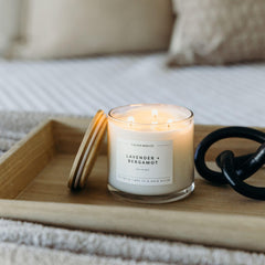 Calyan Wax Co Lavender and Bergamot candle on coffee table evokes cozy ambiance