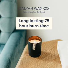 Calyan Wax Co. Lemon & Sage candle flame glow creating cozy ambiance