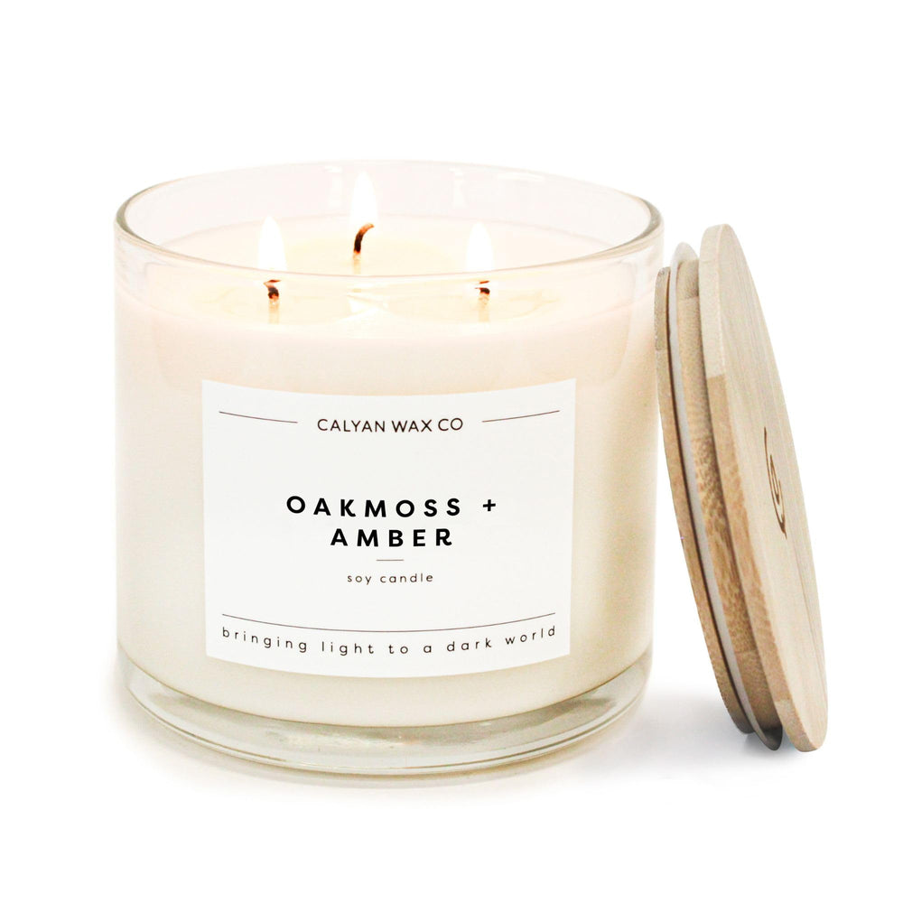 Calyan Wax Co. Oakmoss and Amber 3-wick candle in glass jar for extended ambiance