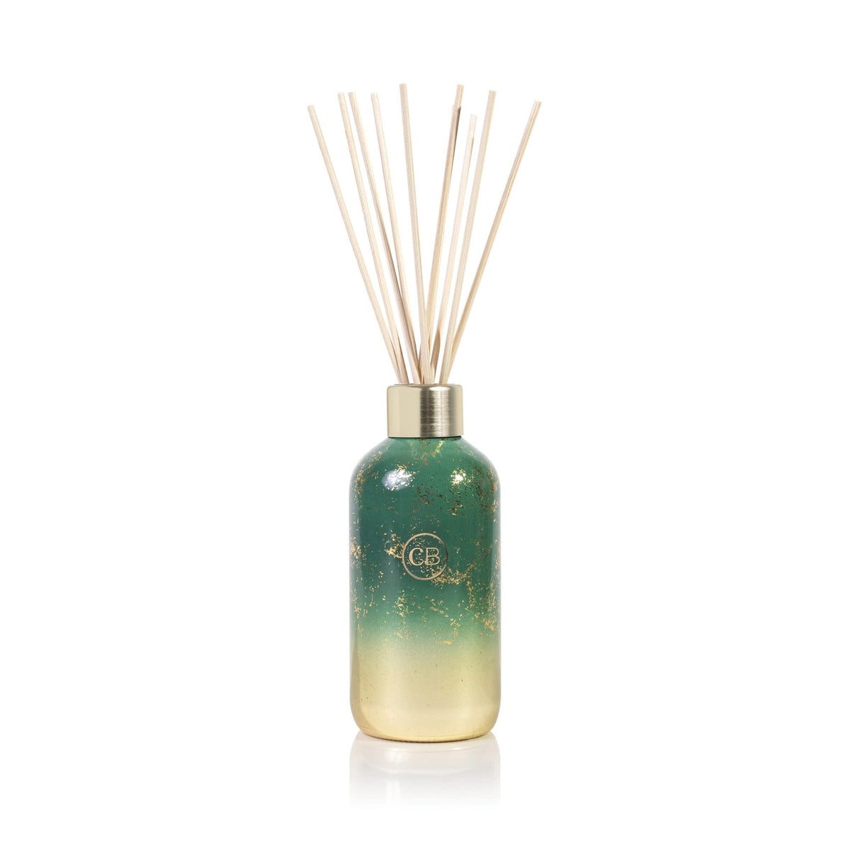 Capri Blue Glimmer Reed Diffuser Crystal Pine bottle provides flame-free scent for rooms.