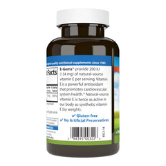 Pouring Carlson E-Gems bottle illustrating daily supplement accessibility.