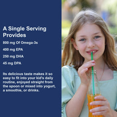 Carlson Kids orange-flavored liquid in measuring spoon for serving