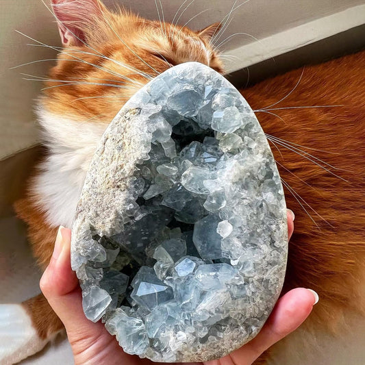 Natural Celestine cluster with blue quartz geode for home decor and calm ambiance.