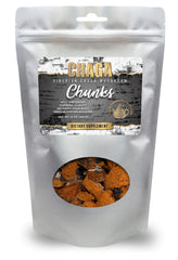 ChagaTeaShop Siberian chaga chunks on wood, ready for infusion.