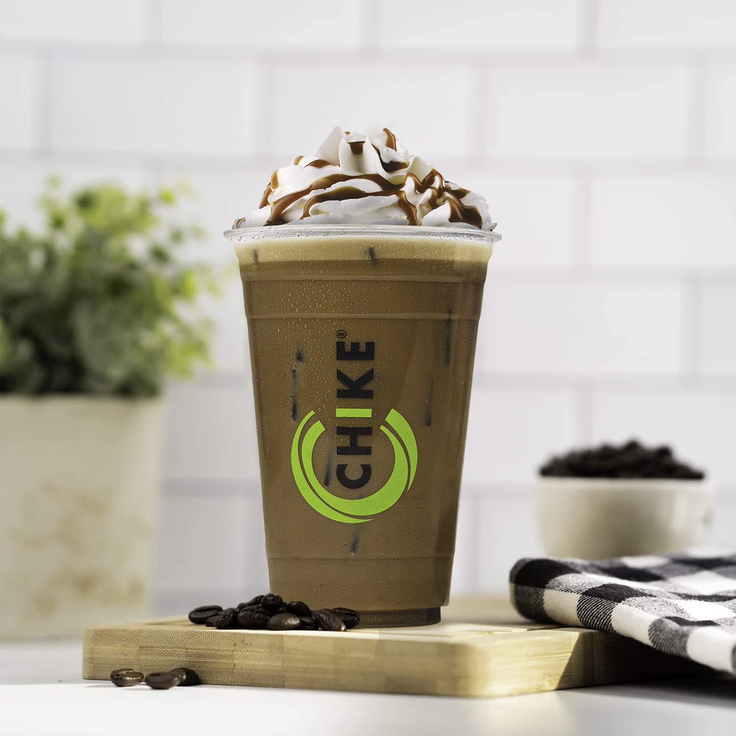 Serving idea with CHIKE iced coffee and ice cubes suggests quick energy on the go.
