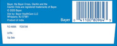 Claritin bottle on kitchen counter with clear label.