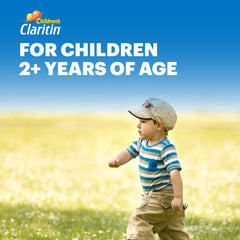 Child chewing a grape Claritin tablet for allergy relief.