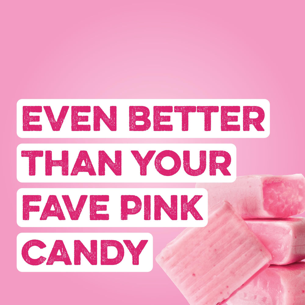 Pouring Pink Burst Clear Protein into a glass for a refreshing shake.