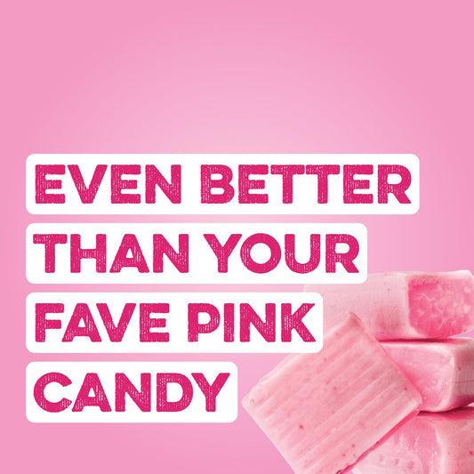 Pouring Pink Burst Clear Protein into a glass for a refreshing shake.