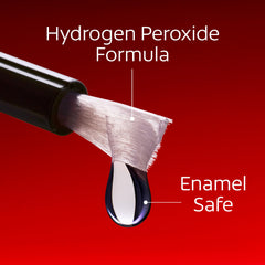 Close-up of the pen tip applying whitening gel before bed for enamel-safe whitening