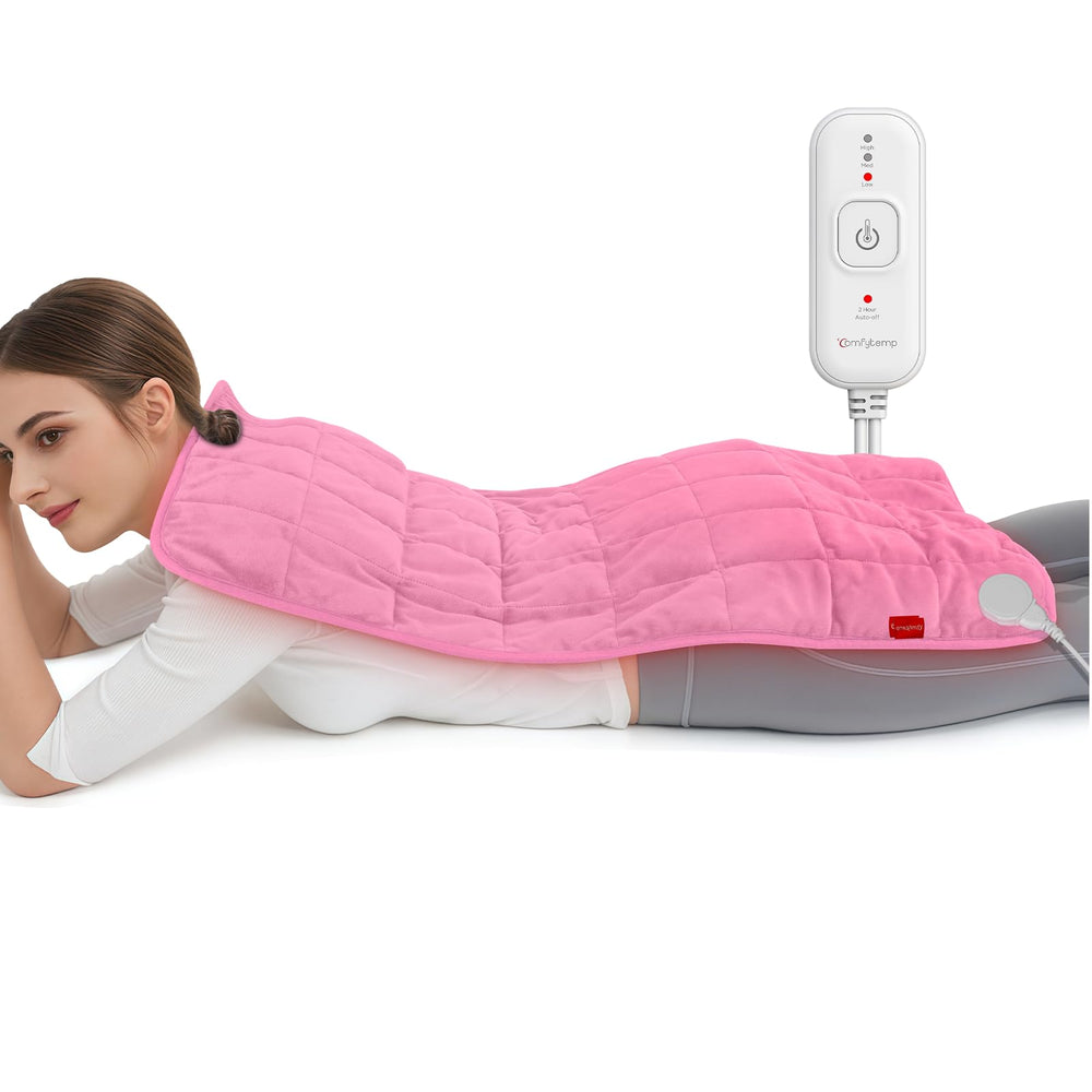 Comfytemp pink weighted heating pad on bed for full-body warmth and comfort
