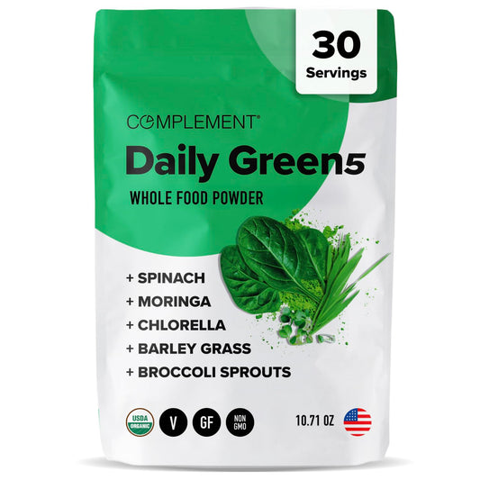 Complement Daily Greens Powder bottle on counter for convenient daily greens
