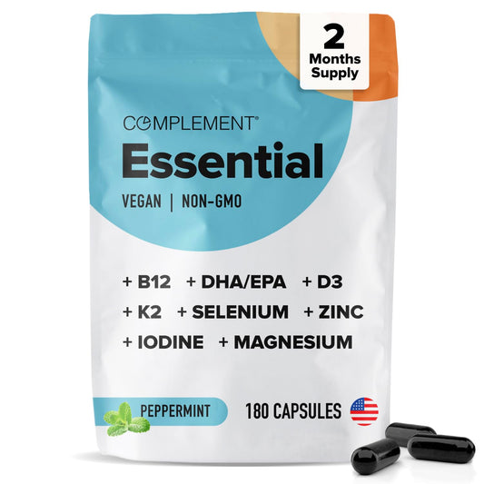 Complement Essential vegan multivitamin bottle front with capsules for daily energy support.