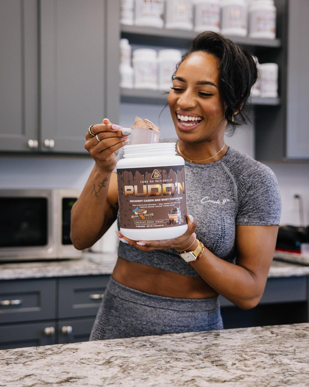 Serving-size scoop of Core Nutritionals Pudd'n ready to mix.