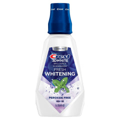 Crest 3D White Brilliance mouthwash 1-liter bottle on shelf for easy access