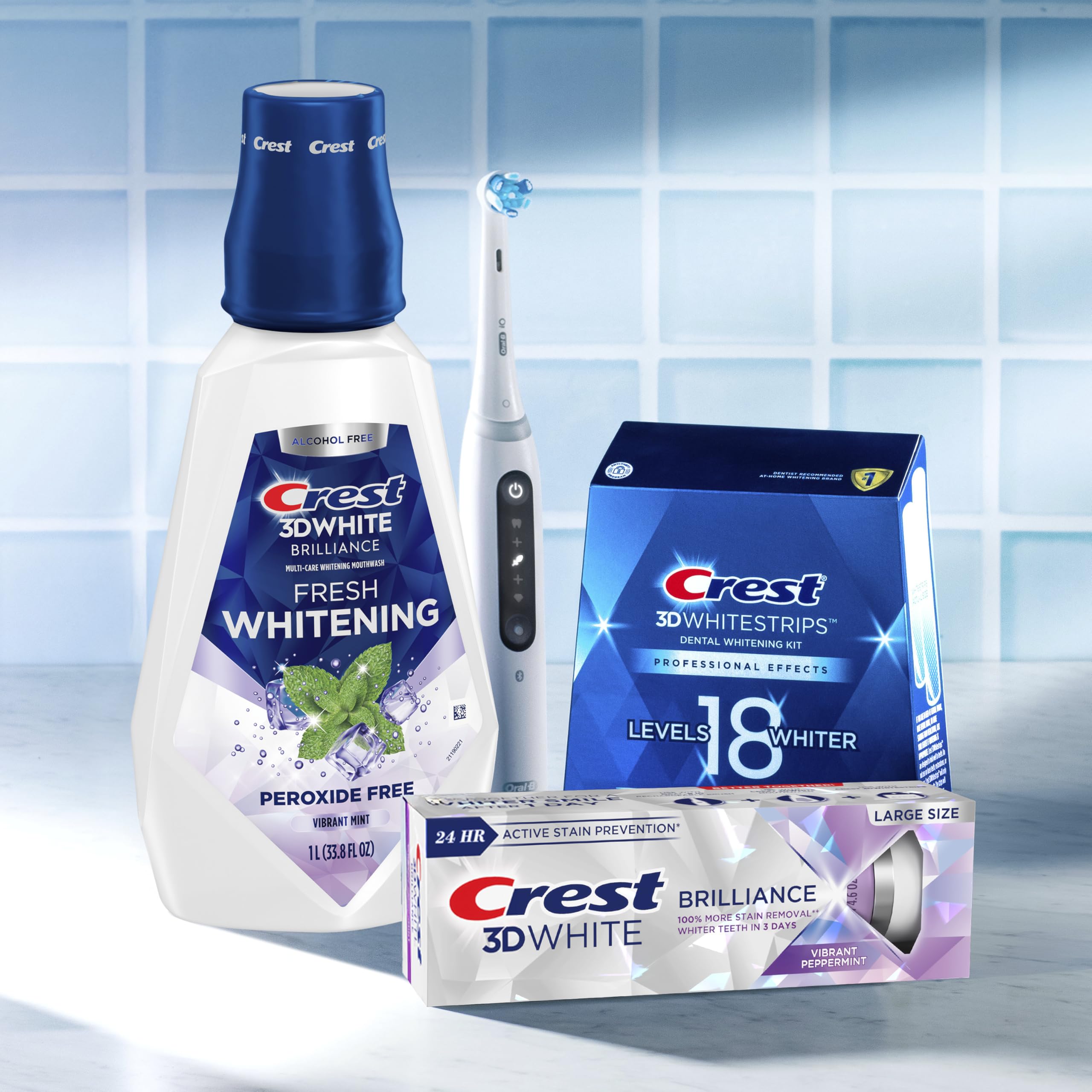 Crest 3D White Brilliance mouthwash pack shot showing six 1L bottles